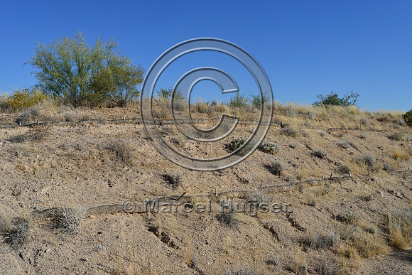 Straw fiber rolls to control erosion on a road cut, Hwy 87, Arizona, USA