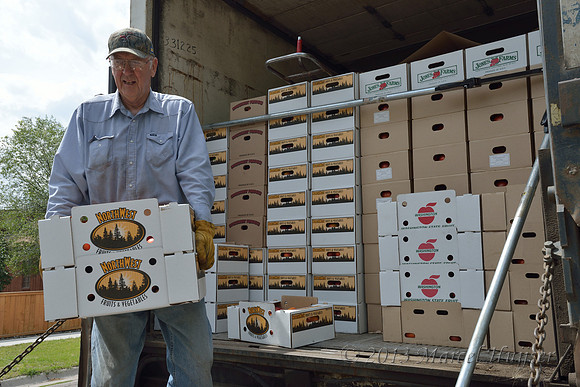 Unloading fruit, Missoula, Montana, USA.