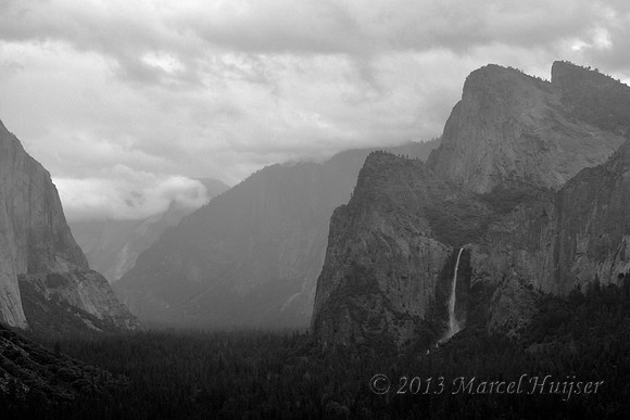 Yosemite Valley and Bridalveil Fall in heavy clouds and rain, Yosemite National Park, California, USA