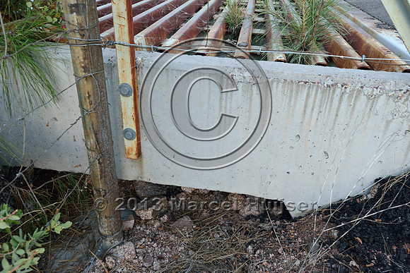 Double wide cattle guard as a barrier for deer and elk with drainage and escape for small species, east of Payson, Arizona, USA
