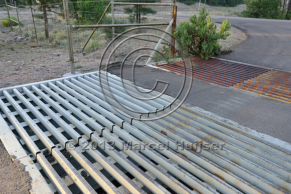 Double wide cattle guard as a barrier for deer (Odocoileus spp.) and elk (Cervus canadensis) at access road for NF 405A, at jct with SR 260, east of Payson, Arizona, USA