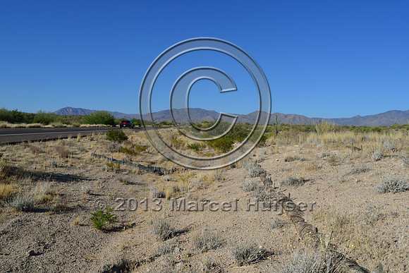 Straw fiber rolls to control erosion on a road cut, Hwy 87, Arizona, USA