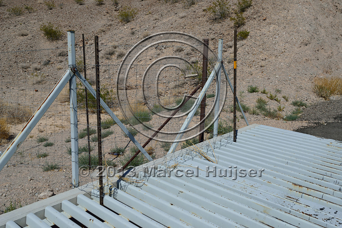 Blocked concrete edge at side of wildlife guard at access road US Hwy 93, Arizona, USA