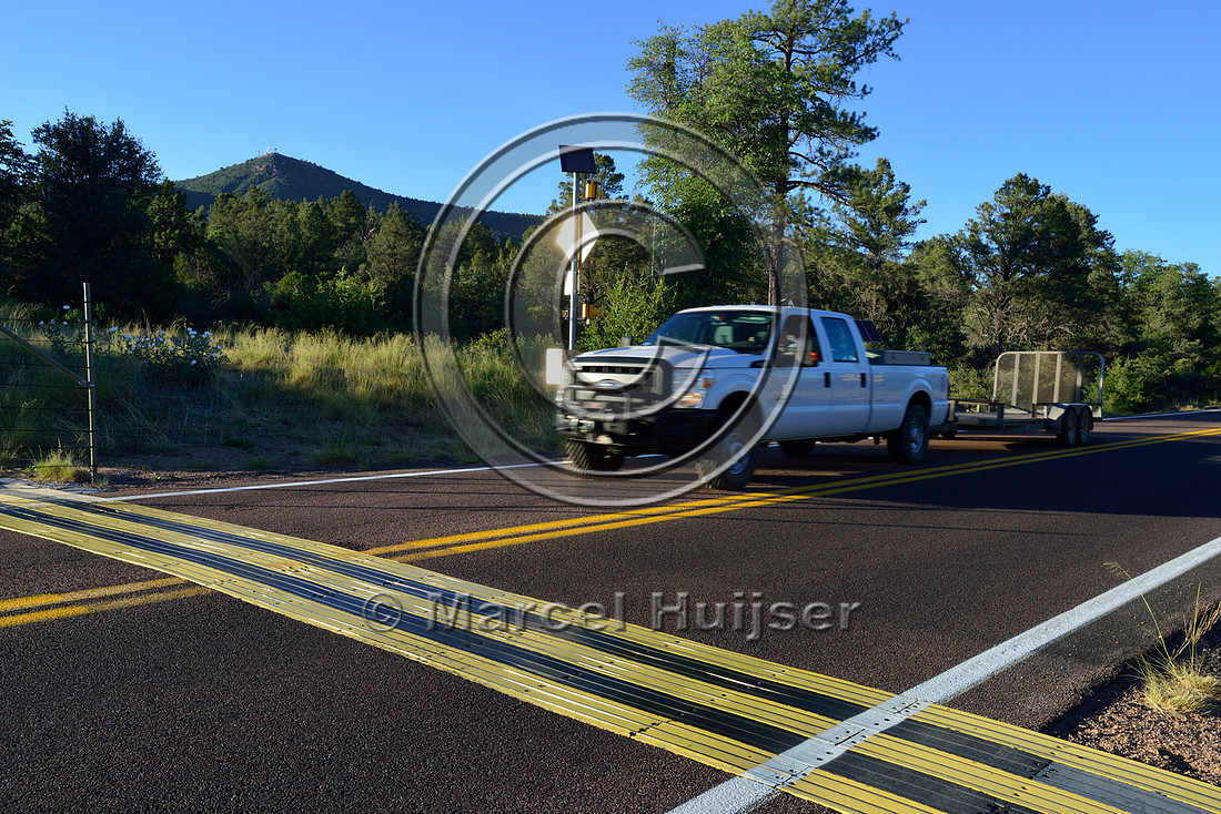 Electric mat (CrossTek™) associated with an animal detection and driver warning system at a fence end, S.R. 260 east of Payson, Arizona, USA
