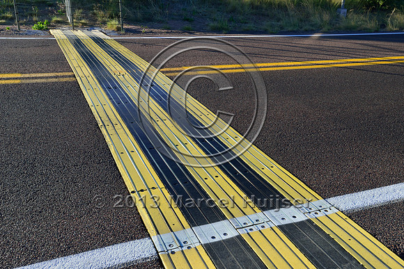 Electric mat associated with an animal detection and driver warning system at a fence end, S.R. 260 east of Payson, Arizona, USA