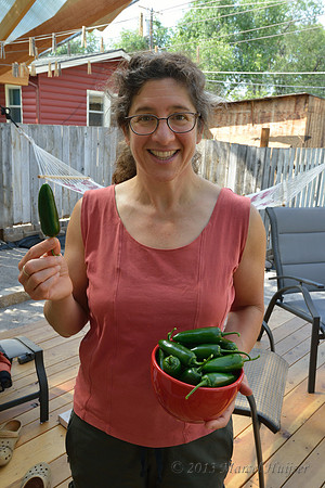 Bethanie Walder and freshley harvested jalapeño peppers from our greenhouse, Missoula, Montana, USA