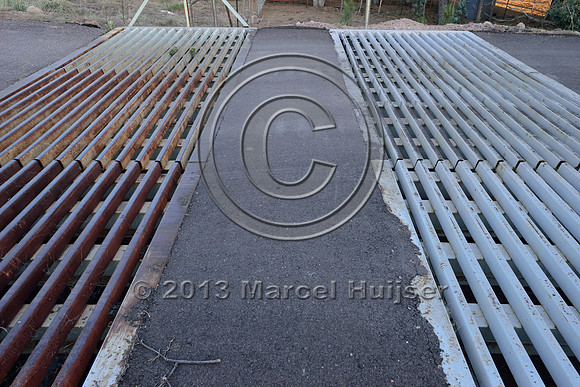 Double wide cattle guard as a barrier for deer (Odocoileus spp.) and elk (Cervus canadensis) at access road for NF 405A, at jct with SR 260, east of Payson, Arizona, USA