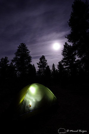 Illuminated tent with moonlit sky, Arizona, USA