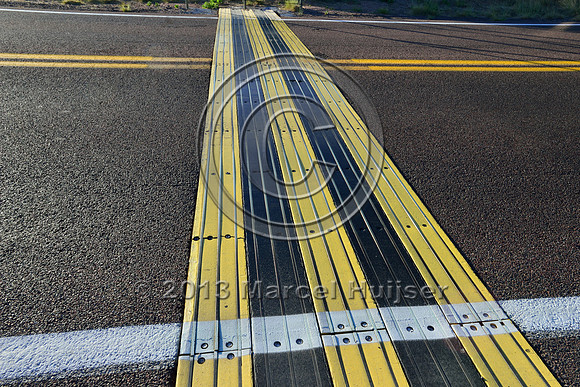 Electric mat associated with an animal detection and driver warning system at a fence end, S.R. 260 east of Payson, Arizona, USA