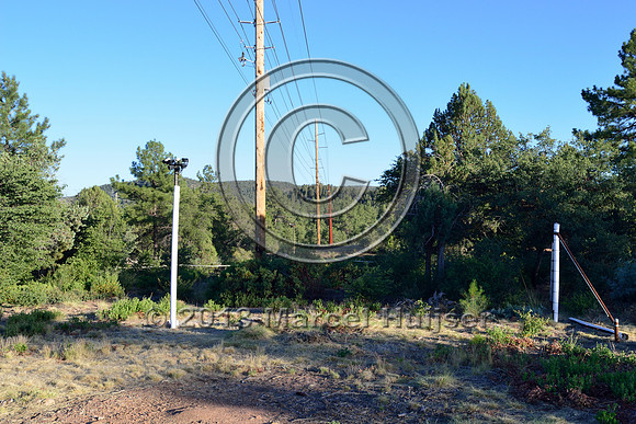 Detection area with sensors and cameras associated with an animal detection and driver warning system at a fence end, S.R. 260 east of Payson, Arizona, USA