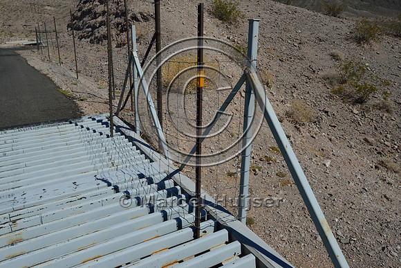 Blocked concrete edge at side of wildlife guard at access road US Hwy 93, Arizona, USA