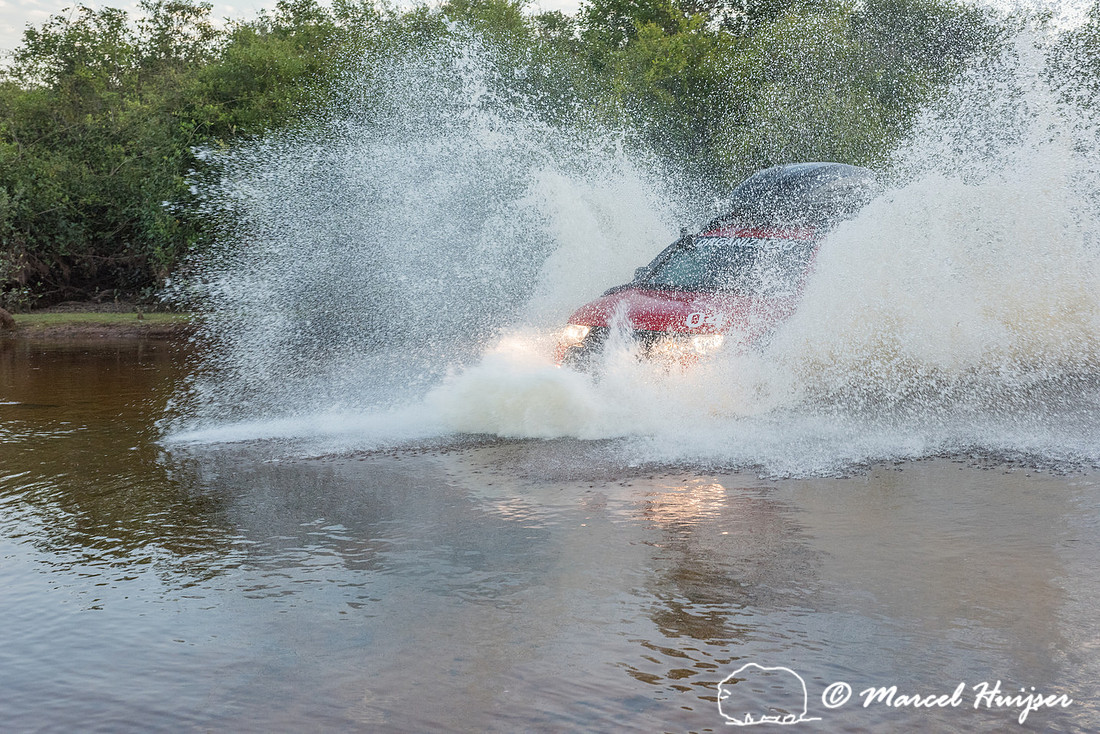 Crossing a stream, Mitsubishi 4x4, L200 Triton Savana, on wildli