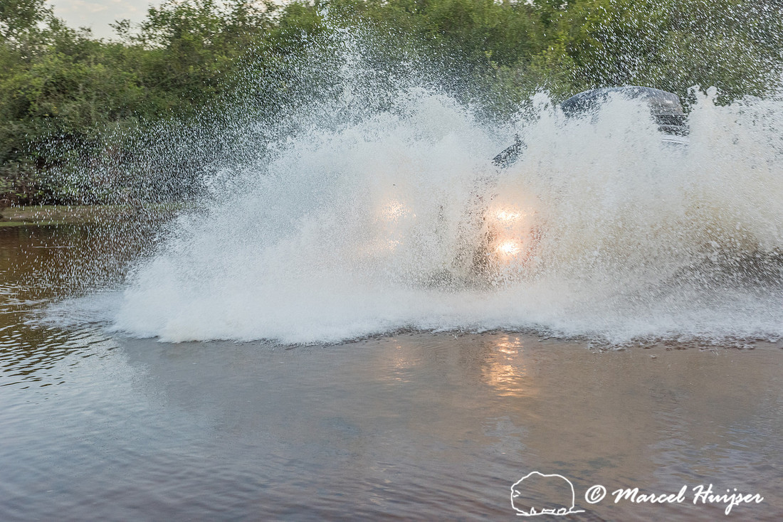Crossing a stream, Mitsubishi 4x4, L200 Triton Savana, on wildli