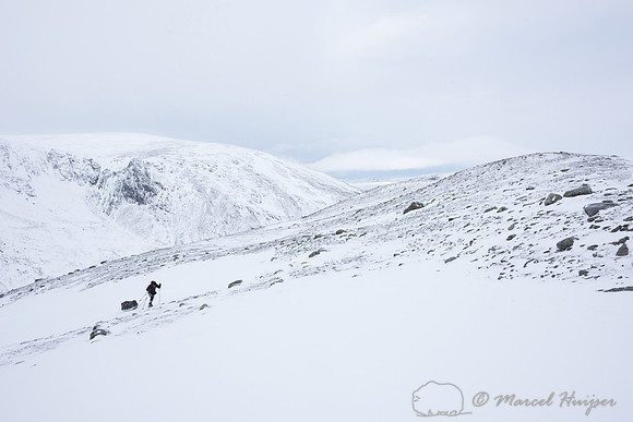 Niels Kooyman drags his sled up a steep slope, Dovrefjell, Norwa