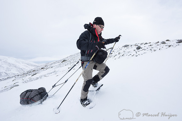 Niels Kooyman drags his sled up a steep slope, Dovrefjell, Norwa