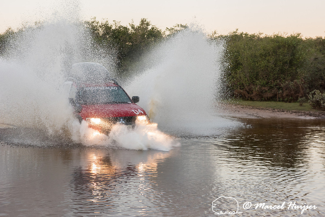 Crossing a stream, Mitsubishi 4x4, L200 Triton Savana, on wildli