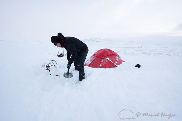 Niels Kooyman digs his sled out of the snow at third camp, Dovre