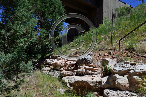 Retaining wall to allow for a wider flat area at wildlife underpass, Arizona, USA.