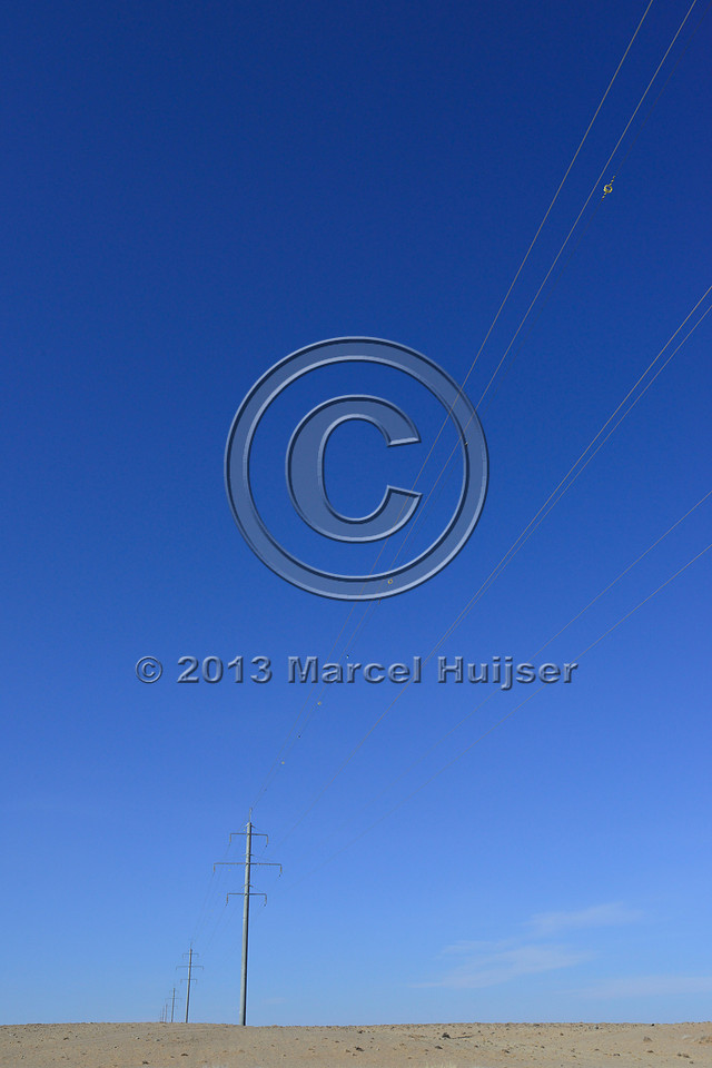 Power lines with markers for birds to reduce bird strikes, between Hanbogd and Oyu Tolgoi, near Hanbogd, Ömnögovi, Mongolia
