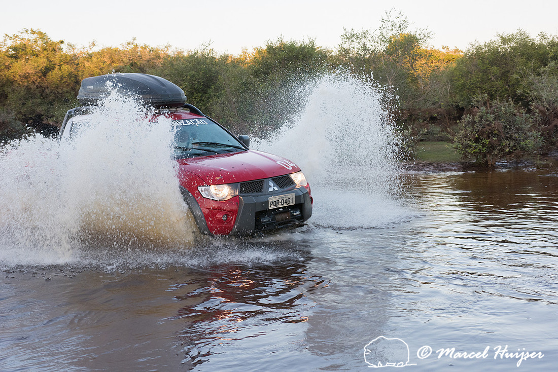 Crossing a stream, Mitsubishi 4x4, L200 Triton Savana, on wildli