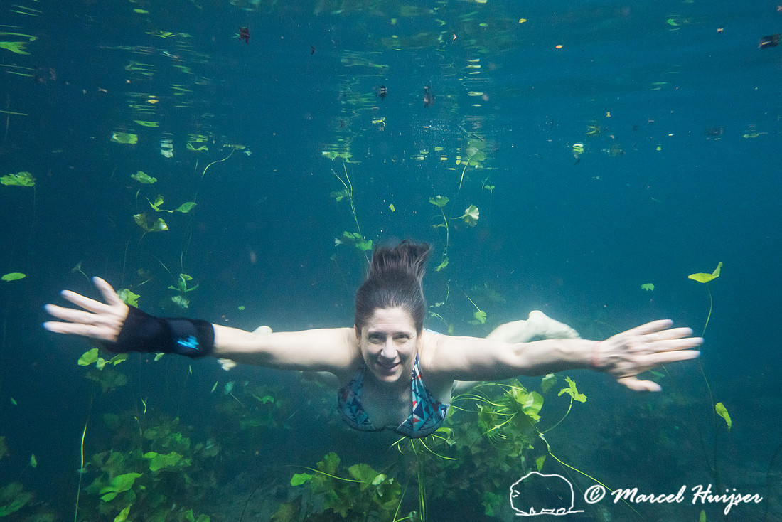 Bethanie Walder swims in a cenote, Yucatán, Mexico