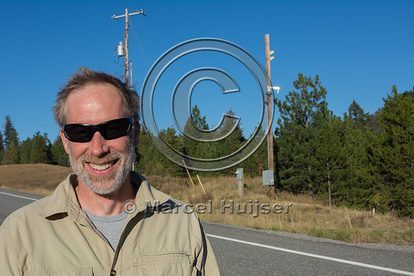 Marcel Huijser at animal detection system on frontage road next