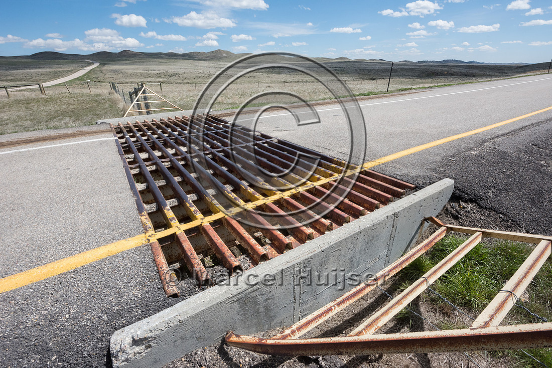 Cattle guard at off ramp at Reno road interchange along I-25, mi