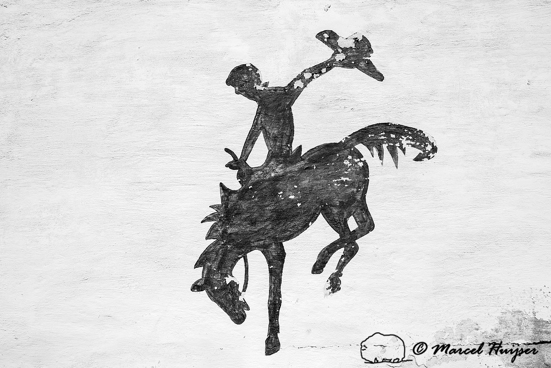 Bucking horse and rider logo, mural in a small town, Wyoming, US