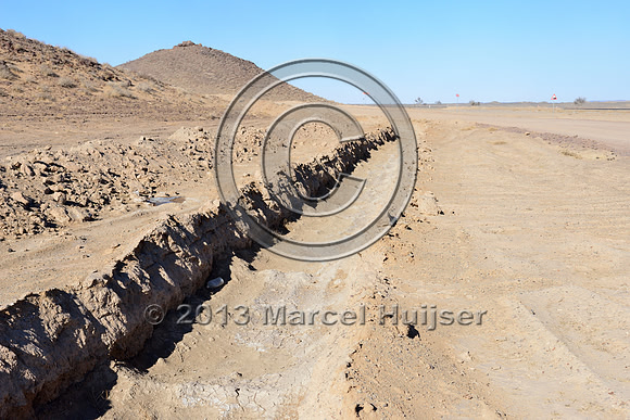 Trench to discourage vehicles from leaving the road, just south of the settlement of Tsagaan khad (White Rock), north of Gashuun-Sukhait, Gobi, Mongolia