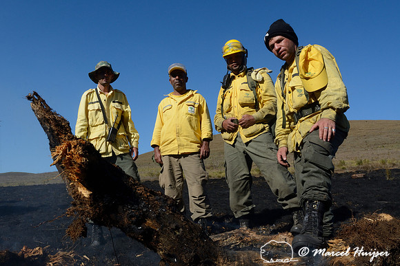 Fire fighters after putting out a grassland fire, Parque Nacional da Serra da Bocaina, São Paulo, Brazil