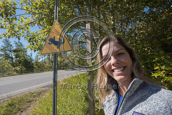 Fernanda Abra at wildlife warning sign for long-toed salamanders