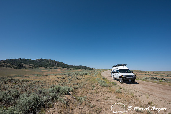 Our camper van on dirt road, Wind River Range,  Wyoming, USA