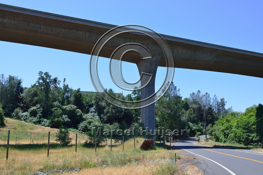 Multifunctional underpass (road and wildlife), wildlife fence and jump-out, near Sonora, California, USA