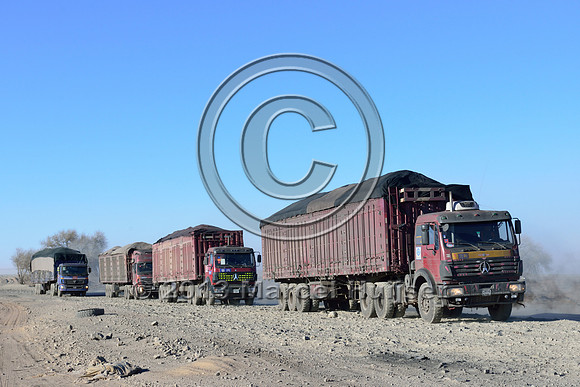 Coal trucks approaching Gashuun-Sukhait, Gobi, Mongolia