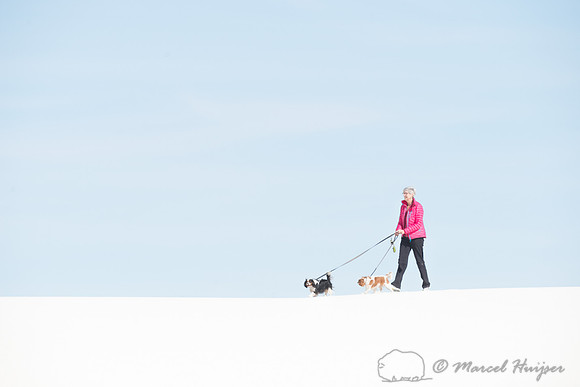 Woman and dogs, White Sands National Monument, New Mexico, USA