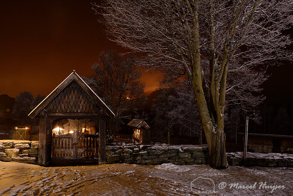 Gate at the Ringebu stave church (stavkyrkje), early 13th century, in winter with ice fog, Ringebu, Norway