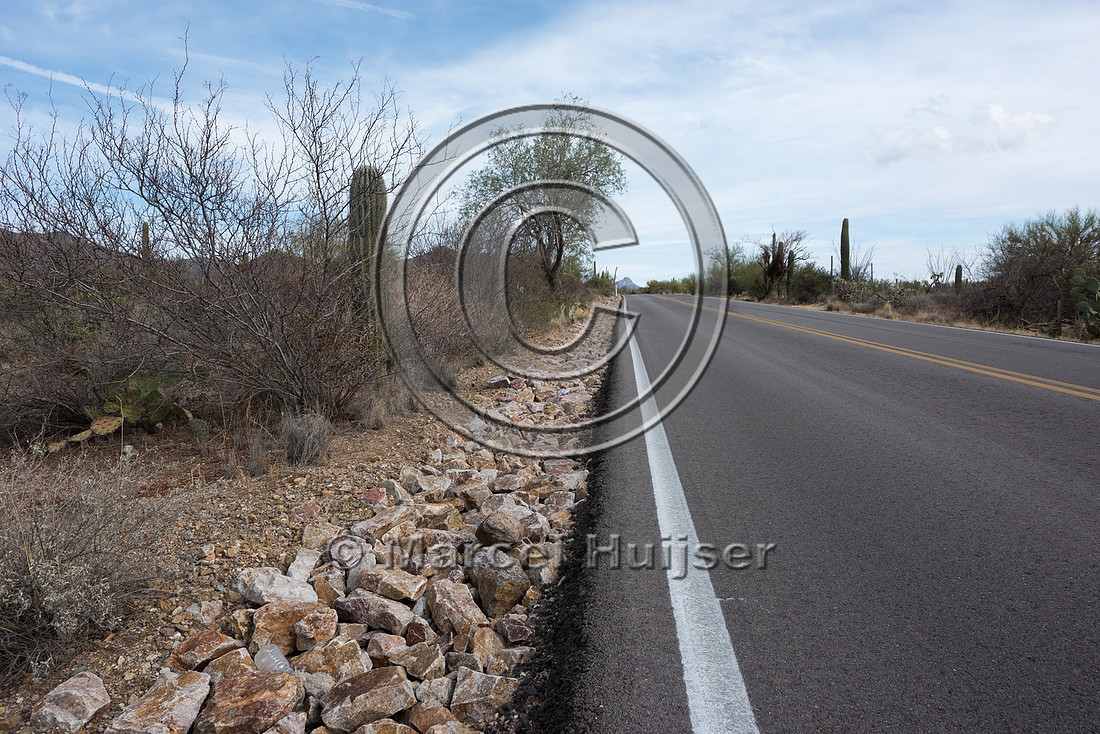 Rock lined drainage along a slope to reduce erosion, Saguaro Nat