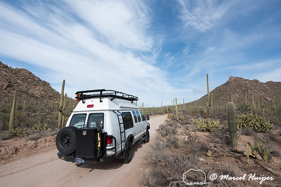 Camper van on dirt road, Saguaro National Park, Arizona, USA