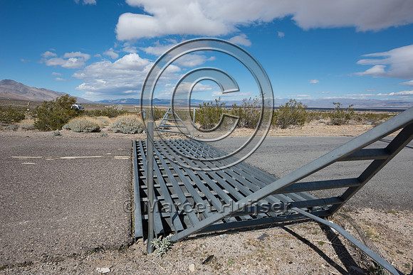 Wildlife and cattle guard at access road in association with fen