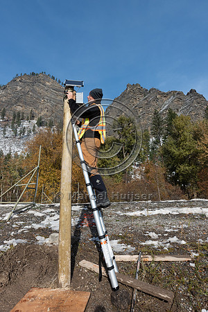 Marcel Huijser installs research equipment at electified barrier