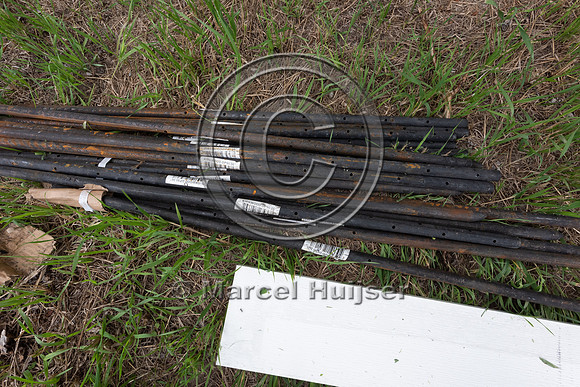 Installing electric fence and gates at a melon field to keep bla