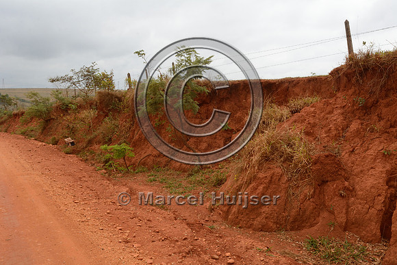 Erosion along a dirt road, loss of pasture land and damaged fence,, near São Roque de Minas, Minas Gerais, Brazil