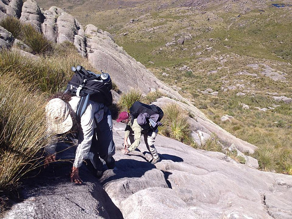 Bethanie Walder and Marcel Huijser climb up the rocks of Rock formations of Pico das Agulhas Negras (Black Needles Peak), Itatiaia National Park, Rio de Janeiro State, Brazil