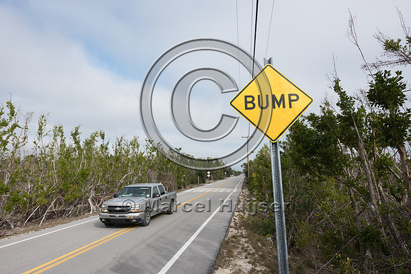 Speed bump painted like a crosswalk to reduce traffic speed for