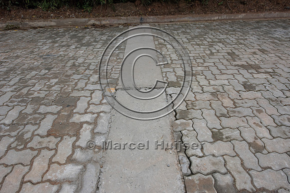 The concrete strip to stabilize pavers,  Brazil