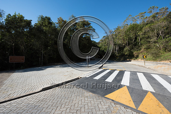 Speed bump and crosswalk at parking area along road, Carlos Bote