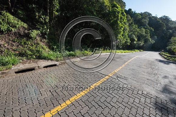 Rolling dip to direct water running down the slope and road off