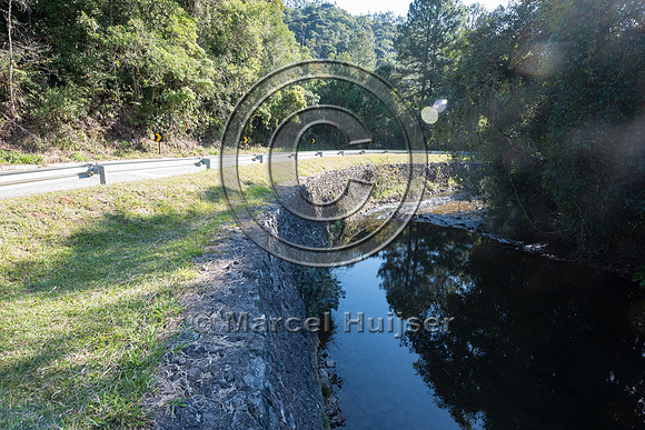 Wall along river to prevent erosion to road bed, Carlos Botelho