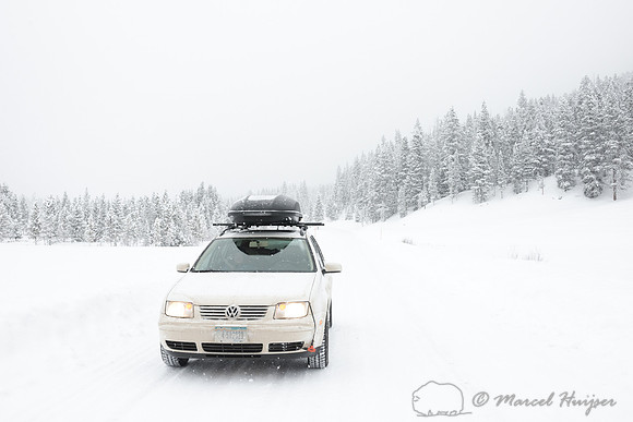 Winter travel on snow covered roads, Wyoming, USA