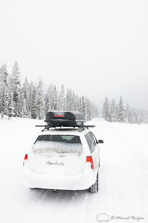 Winter travel on snow covered roads, Wyoming, USA